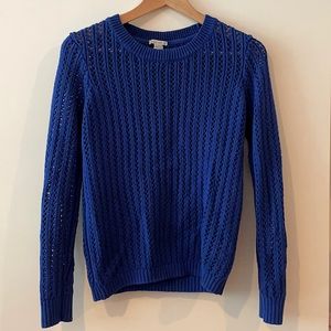 Long-sleeved, bright blue open stitch cable-knit style sweater
